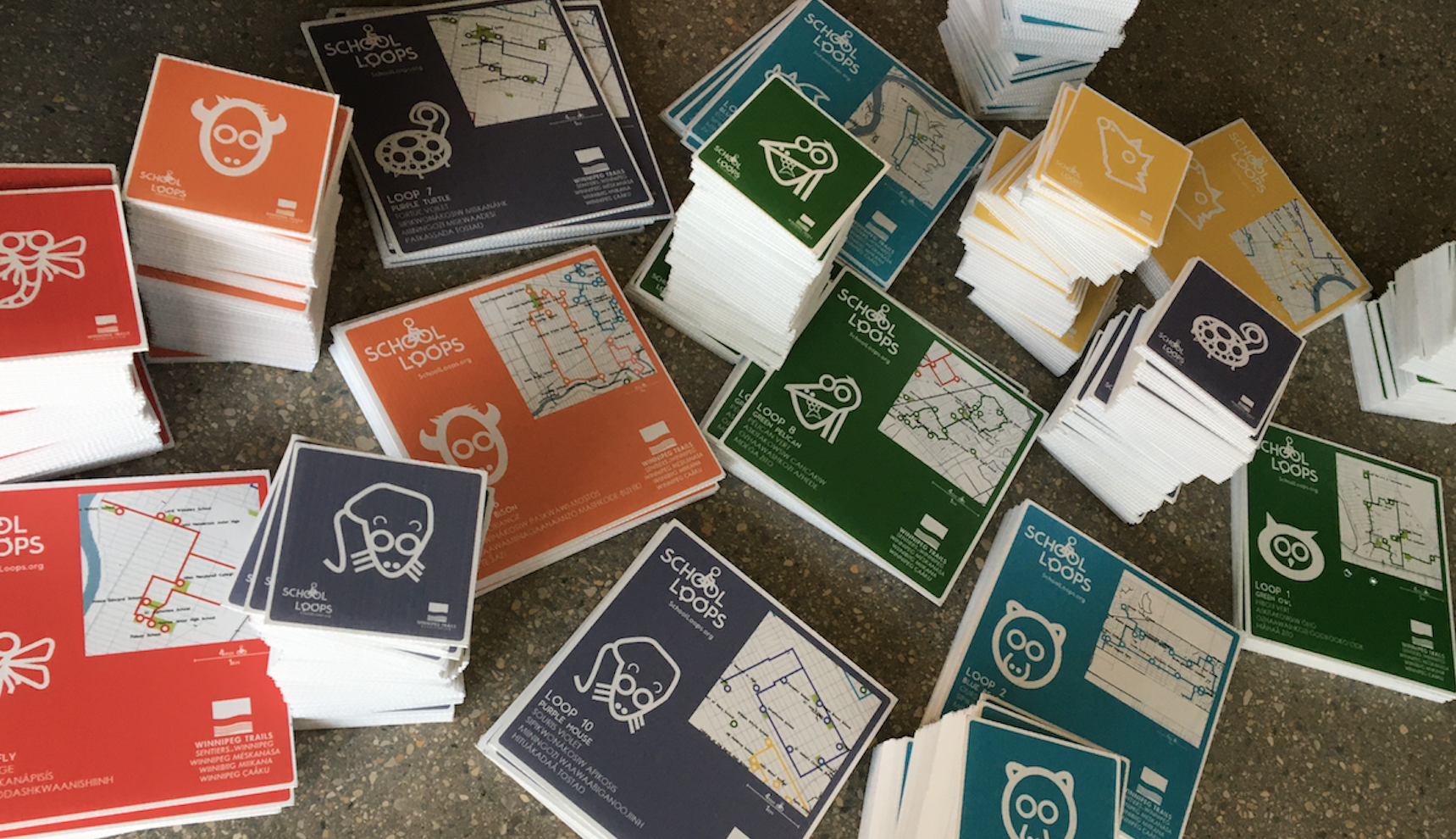 A pile of signs showing various School Loops.