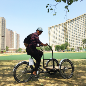 lady smiling while using a trike