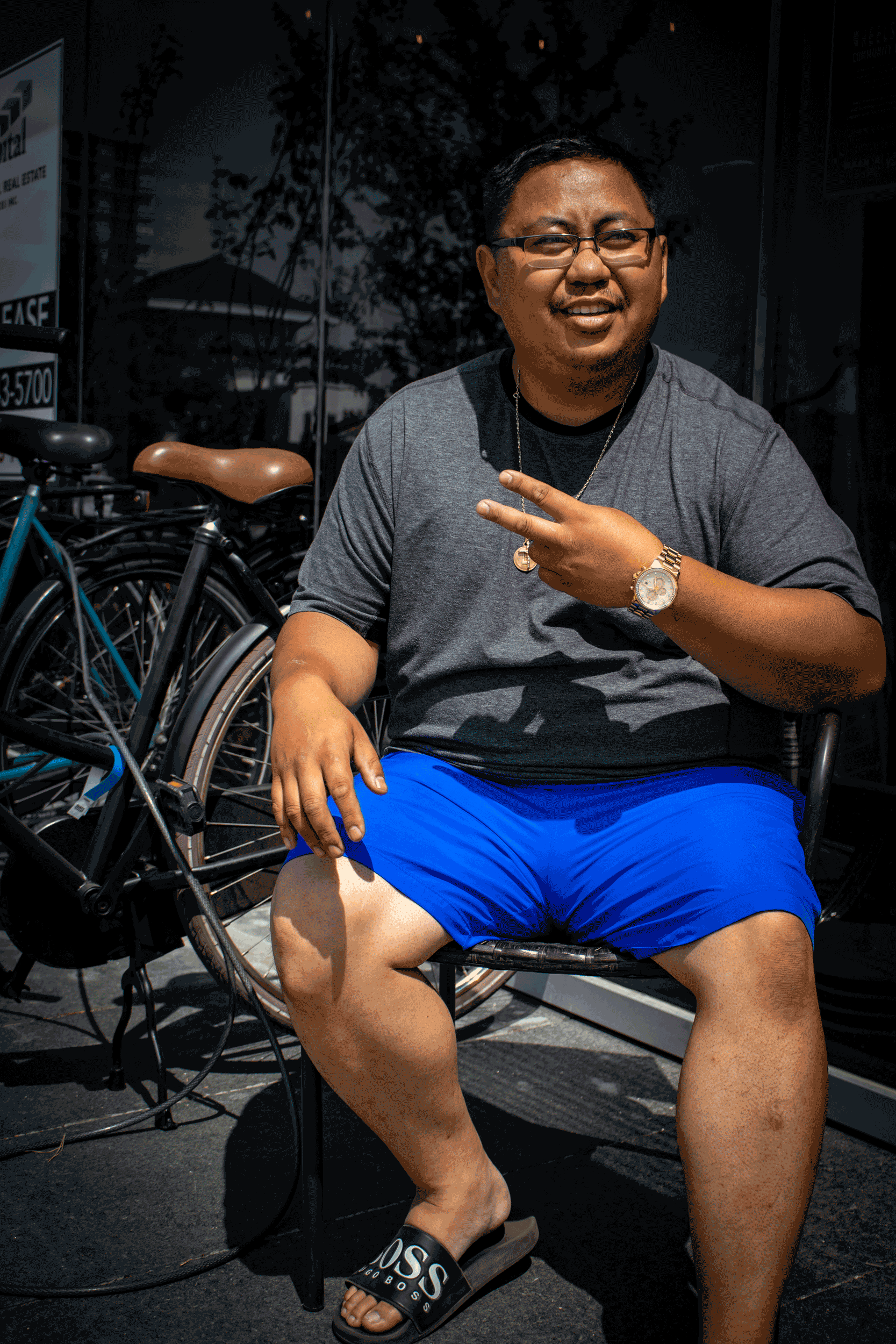 Vincent sitting outside with the bicycle in the background